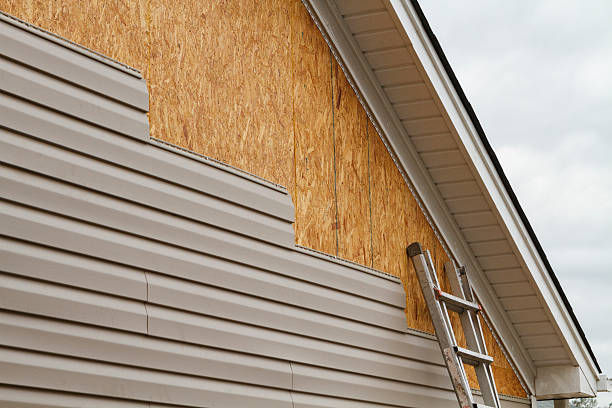 Professional Siding Installation technician working in Lake Grove, NY